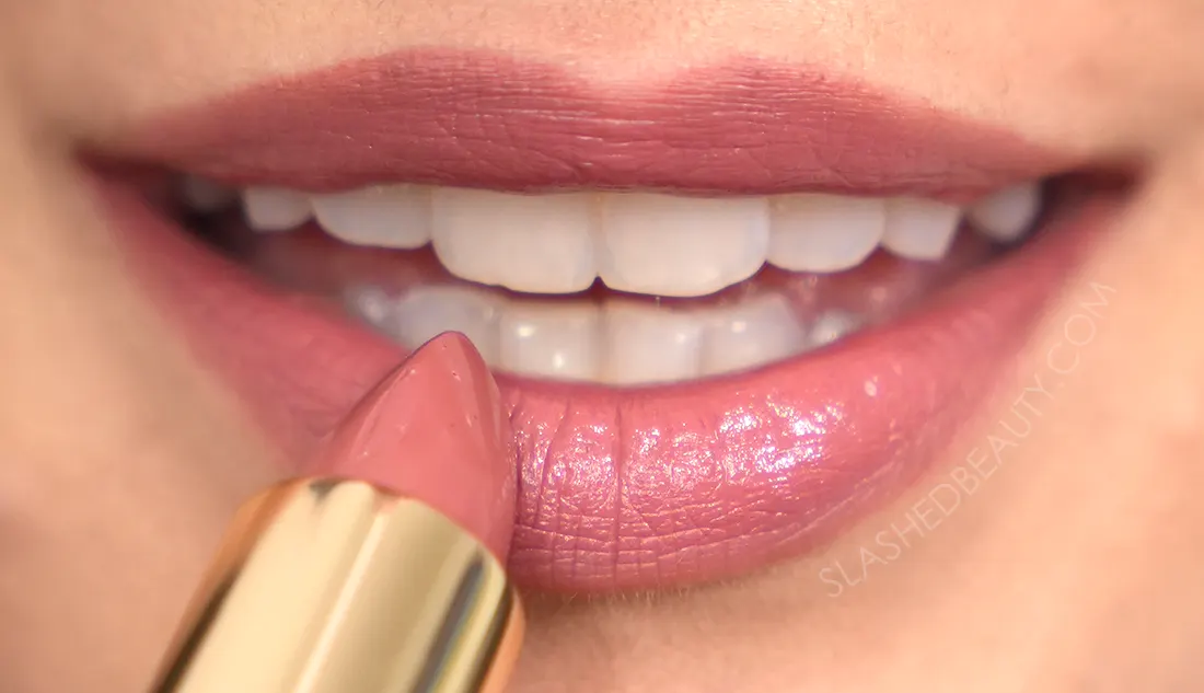 how-to-line-lips-bigger-6 | Slashed Beauty Close up of lips applying lipstick. | How to Make Your Lips Look Bigger with Makeup | Slashed Beauty