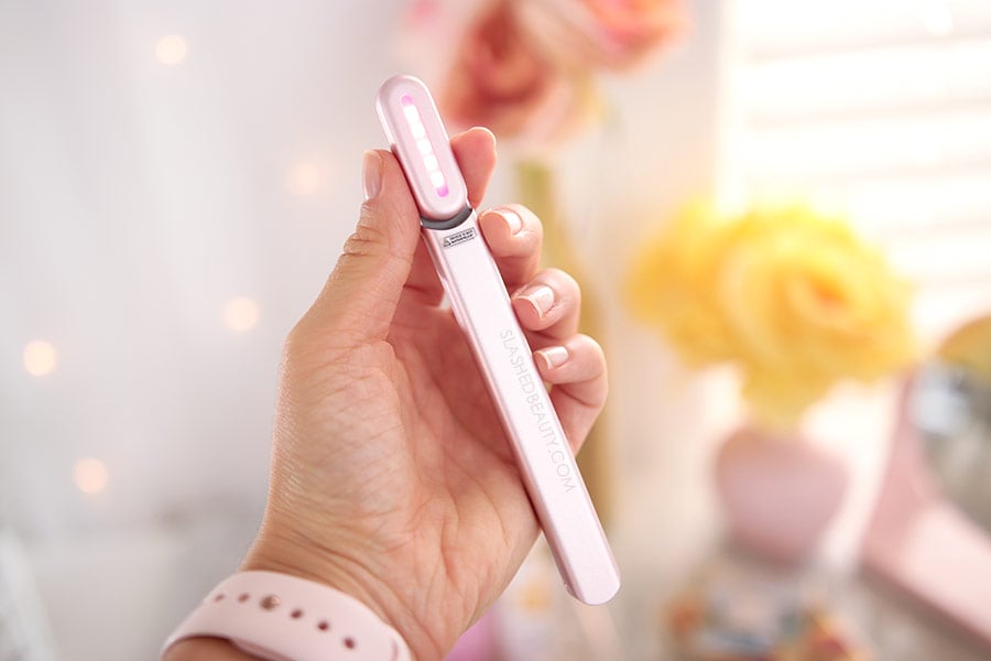 solawave-device-review | Slashed Beauty Holding the SolaWave Skin Care Wand | SolaWave Skin Care Wand Review, Before & After Results | Slashed Beauty