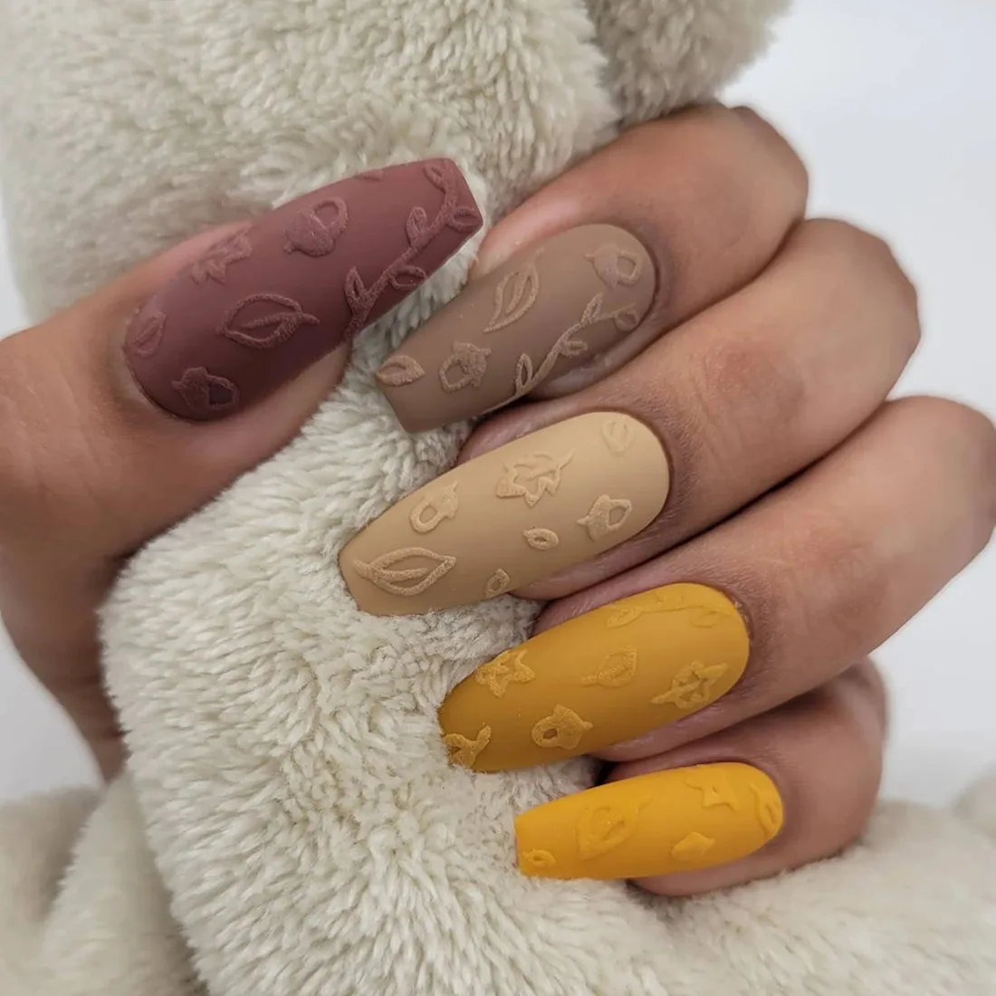 matte-leaf-fall-nail-art-press-ons | Slashed Beauty Matte nails with a raised texture in the shape of leaves | Trendy Fall Nail Designs You Can Buy as Press-Ons on Etsy | Slashed Beauty