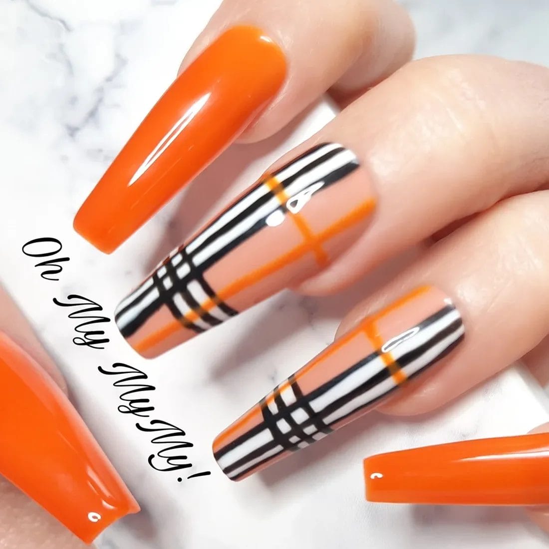 orange-plaid-nails-press-on | Slashed Beauty Long orange and plaid nails for fall | Trendy Fall Nail Designs You Can Buy as Press-Ons on Etsy | Slashed Beauty
