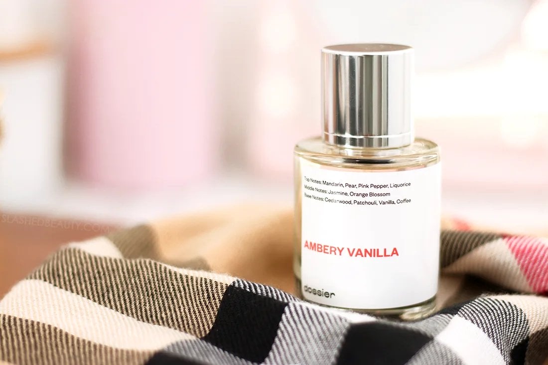 DOSSIER-ambery-vanilla | Slashed Beauty Dossier Ambery Vanilla bottle sitting on a plaid scarf | Dossier Perfume Review: YSL Black Opium Dupe | Slashed Beauty
