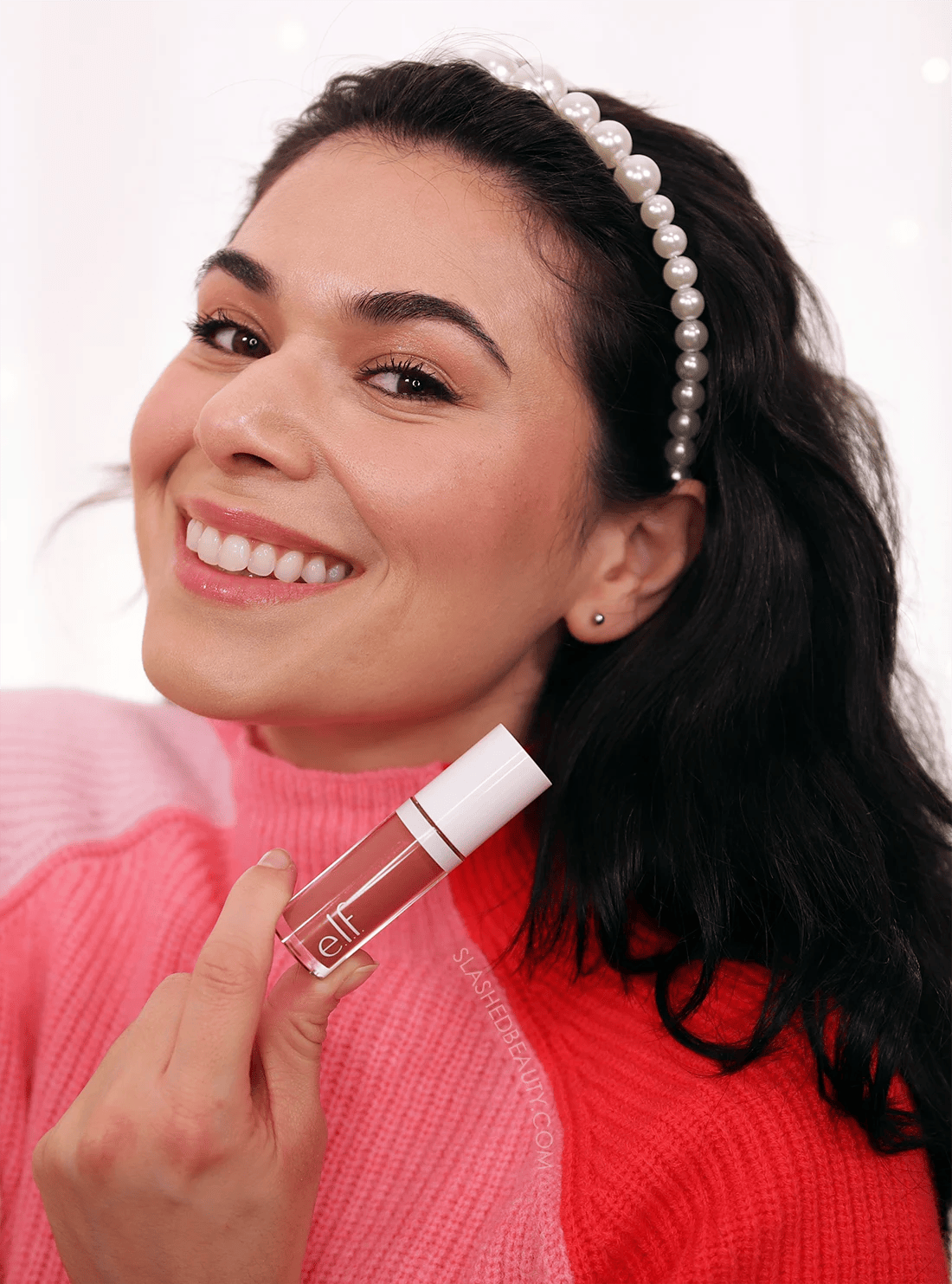 ELF-camo-blush-suave-mauve | Slashed Beauty Miranda smiling to camera holding up tube of e.l.f. Camo Liquid Blush in Suave Mauve | e.l.f. Camo Liquid Blush Review & Swatches | Slashed Beauty
