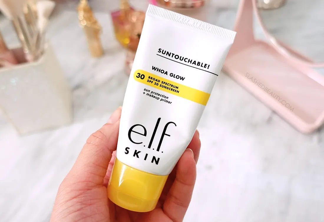 ELF-woah-glow-sunscreen-primer | Slashed Beauty Hand holding tube of e.l.f. Woah Glow Sunscreen Primer | The 5 Best New Drugstore Beauty Finds of 2023 | Slashed Beauty