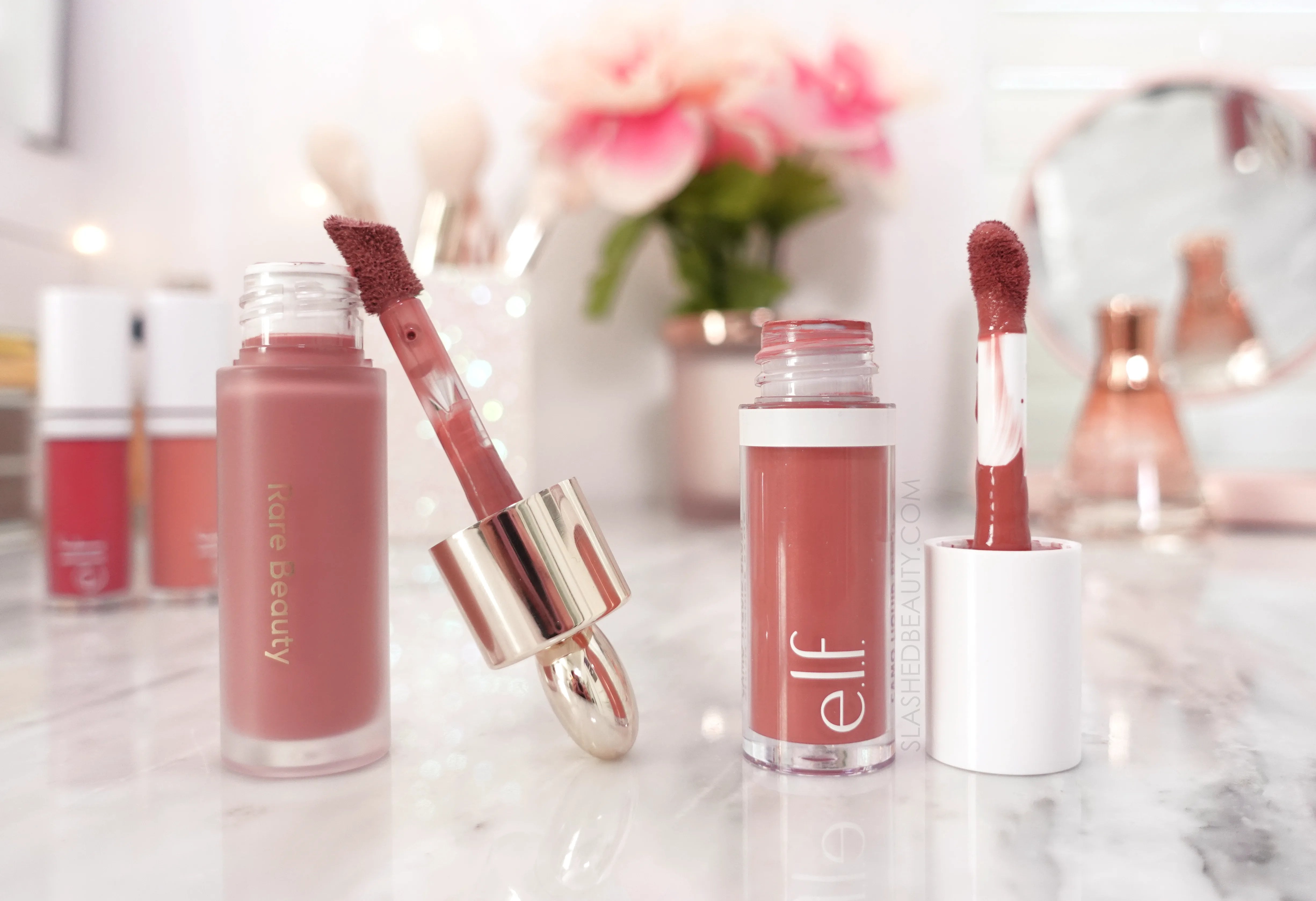 elf-camo-blush-rare-beauty-dupe | Slashed Beauty Open tubes of Rare Beauty Soft Pinch Liquid Blush in Encourage and e.l.f. Camo Liquid Blush in Suave Mauve | e.l.f. Camo Liquid Blush Review - Rare Beauty Dupes? | Slashed Beauty