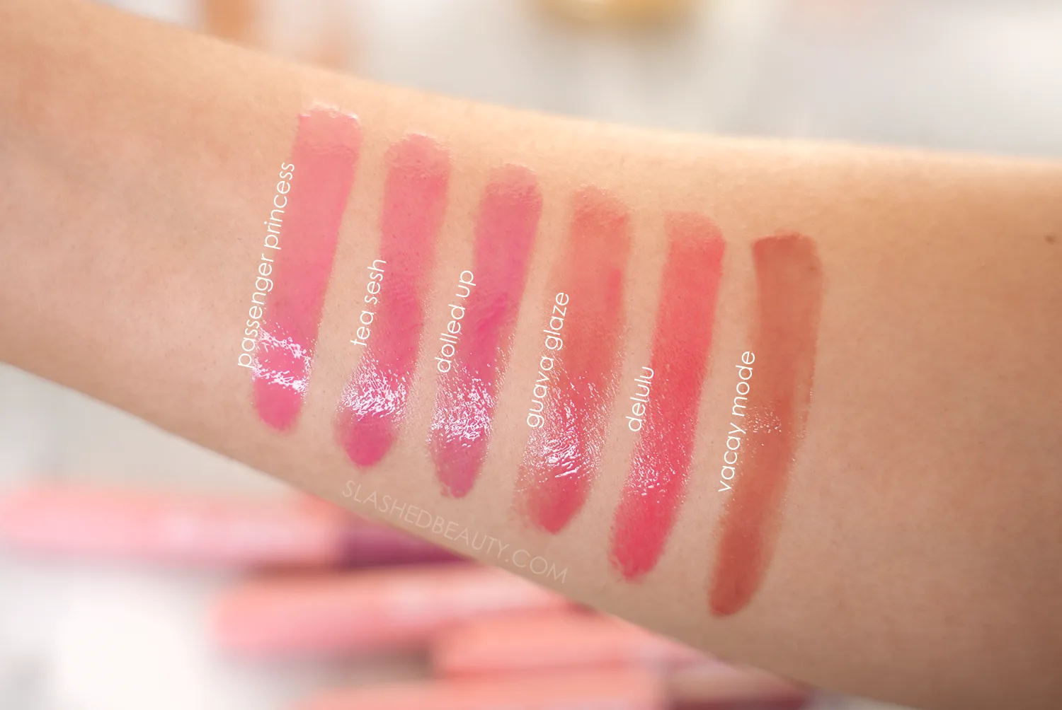 colourpop-so-juicy-balm-swatches | Slashed Beauty Arm swatches of ColourPop So Juicy Plumping Gloss Balms | Shades: Passenger Princess, Tea Sesh, Dolled Up, Guava Glaze, Delulu, Vacay Mode | Slashed Beauty